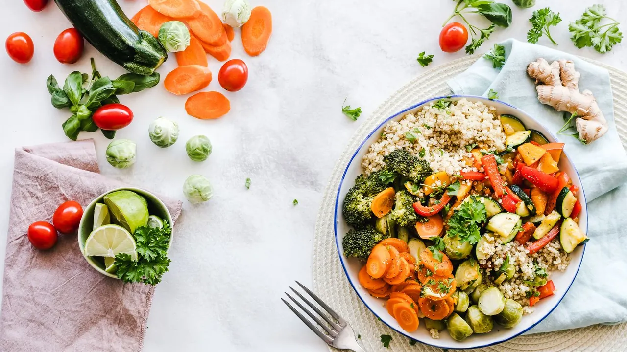 Flat-lay photography of colorful quinoa salad with fresh vegetables